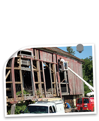 Krueger Electric helping remove barn boards